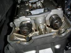 Loosening valve cover bolt - click for larger image